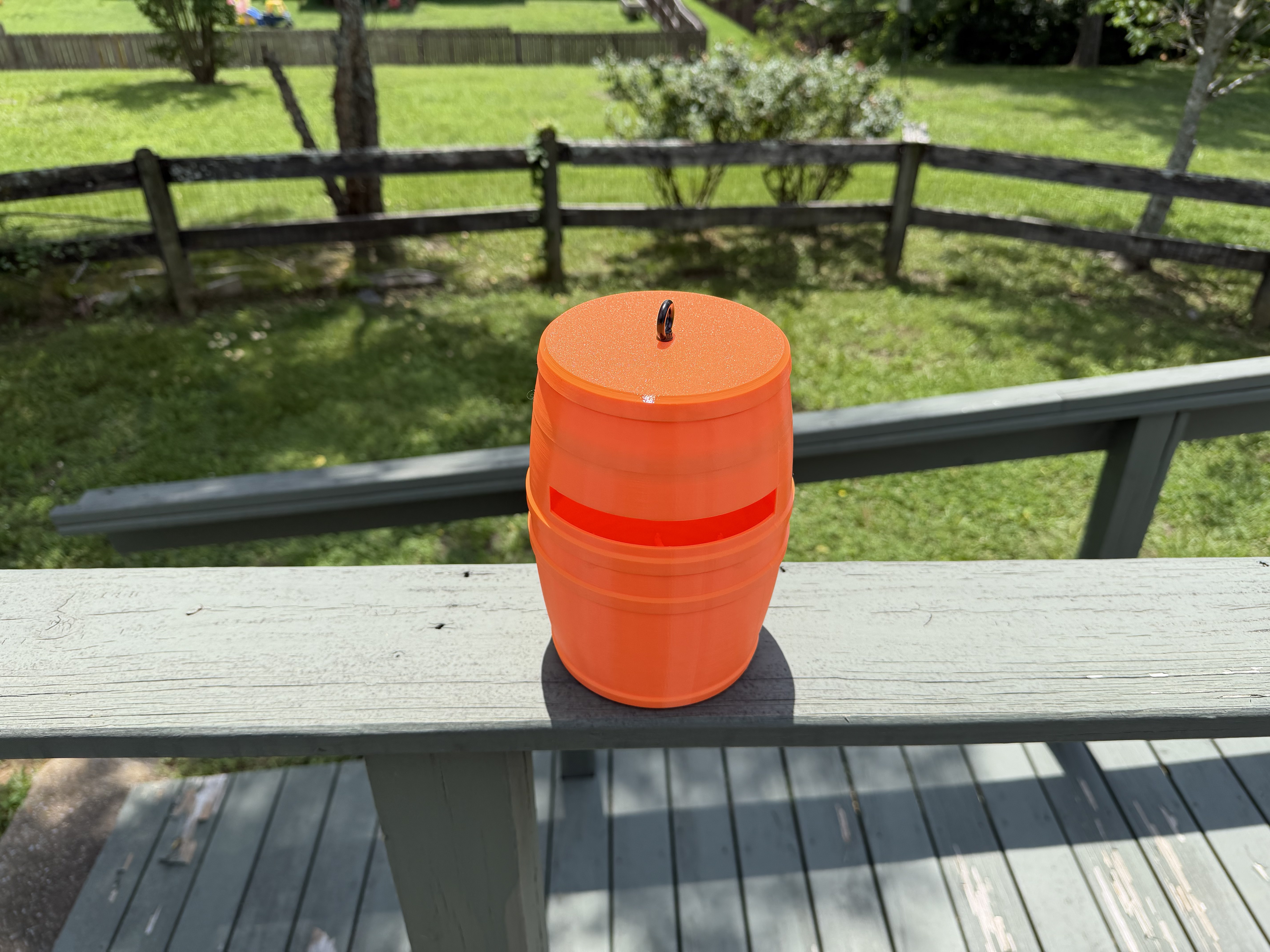 Orange barrel open with lid on deck